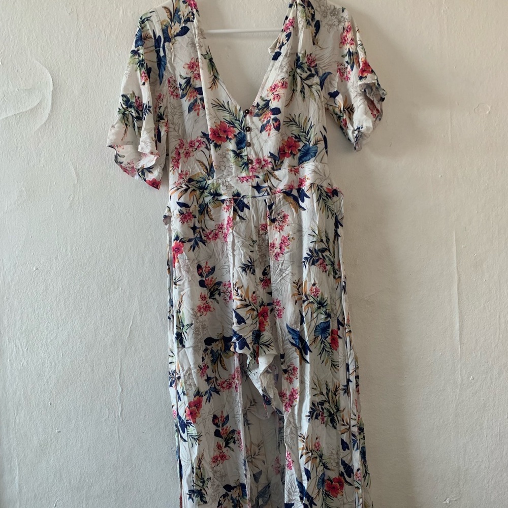 A romper with a long train and open back.